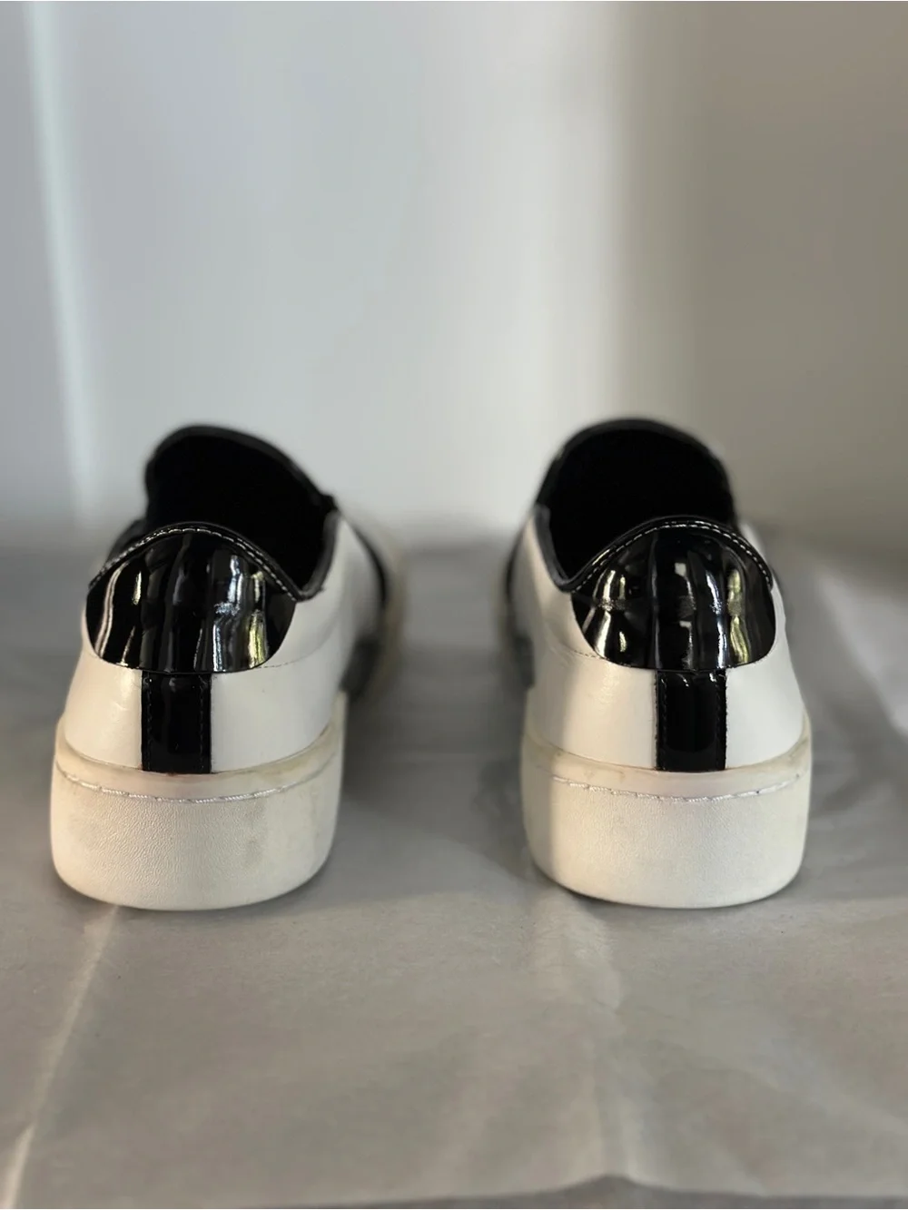 Michael Kors White and Black Slip-On Sneakers